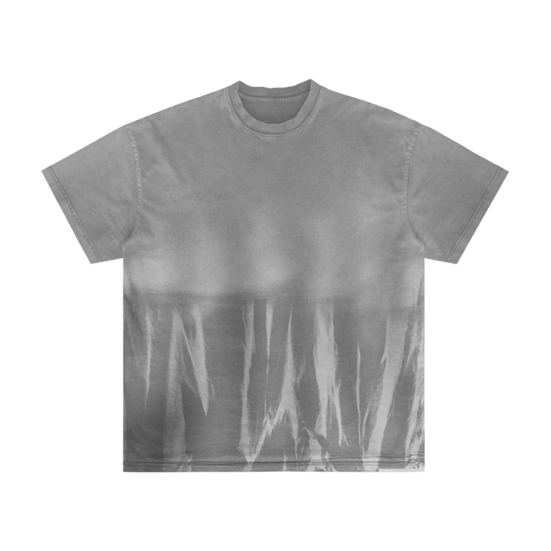 The O8S - DROP 02 - itm7 by Machina - Wearable Technology is a gray short-sleeve t-shirt featuring a white tie-dye streaked pattern on the lower half, while the upper portion remains solid gray for a modern, abstract look.