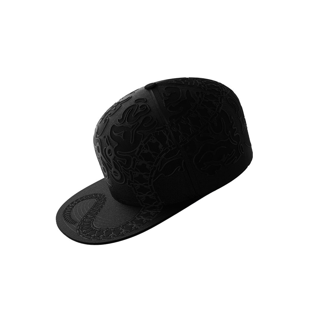 A black Neuro Loop Cap by Machina - Wearable Technology features an embossed dragon Ouroboros design flowing over the top, side, and brim, creating unique texture and standout streetwear style. Shown on a plain white background.