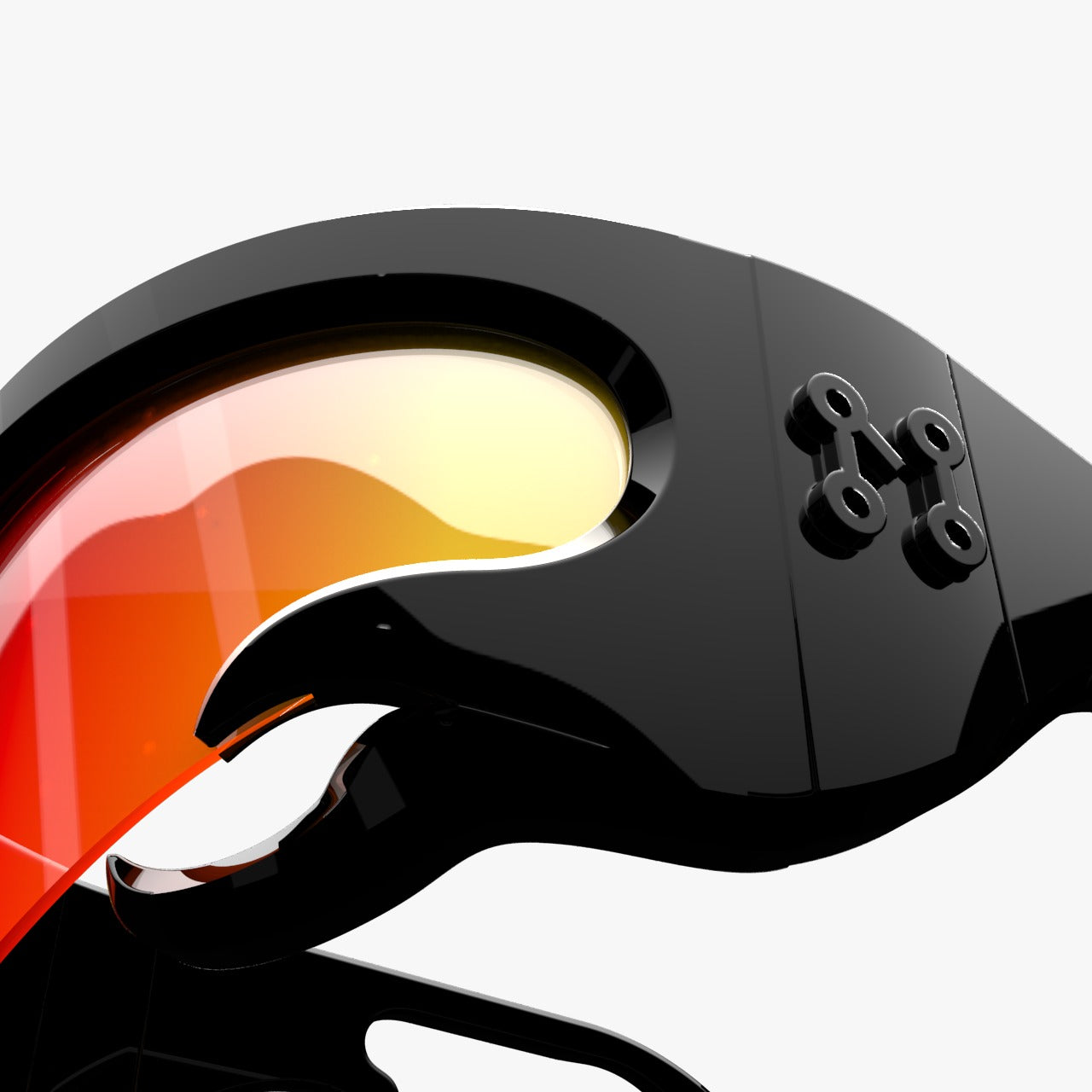 Close-up of a sleek black object with an orange-tinted lens, featuring an abstract, futuristic design and a small emblem. The background is plain white, emphasizing the objects glossy finish.