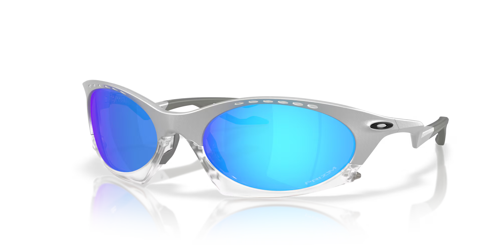 The Machina Plantaris X-Silver Frame sunglasses feature a futuristic silver design with large blue-mirrored lenses, unique top-frame cutouts, an adjustable temple for a perfect fit, and subtle wearable technology branding.