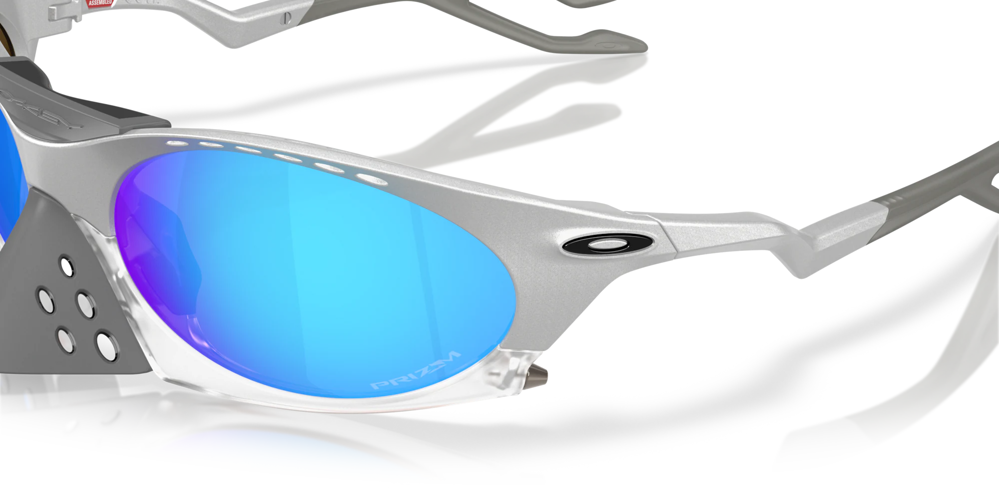 Close-up of the Machina Plantaris X-Silver Frame sunglasses with blue mirrored lenses, showcasing wearable technology and the Machina logo on the side.