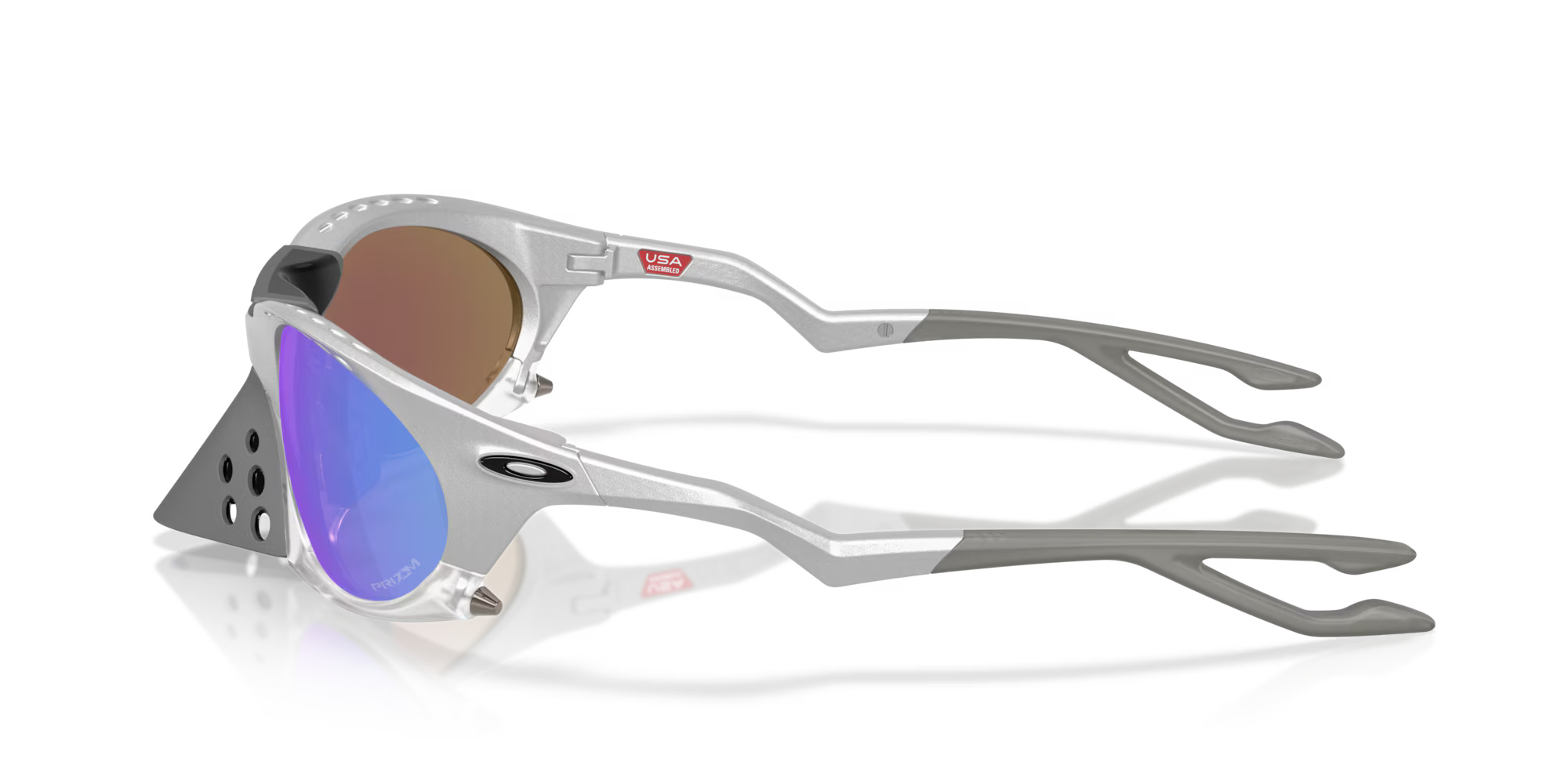 Side view of the Machina - Wearable Technology Plantaris X-Silver Frame sunglasses, featuring iridescent Prizm Lens Technology, gray side arms, and black triangular vented panels near the hinges on a white background.