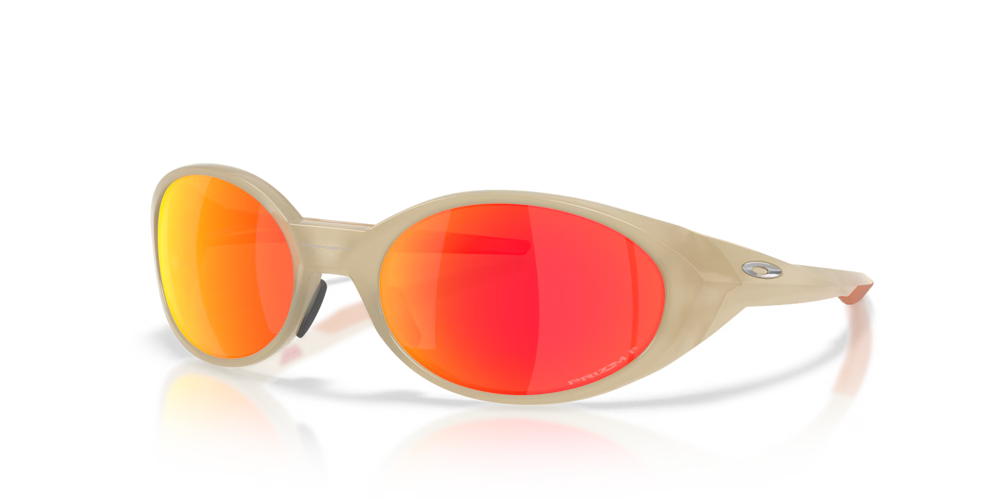 The Machina - Wearable Technology Eye Jacket™ Redux Latitude Collection features beige-framed round sunglasses with bright orange-red mirrored lenses, highlighted on a reflective surface against a plain white background.