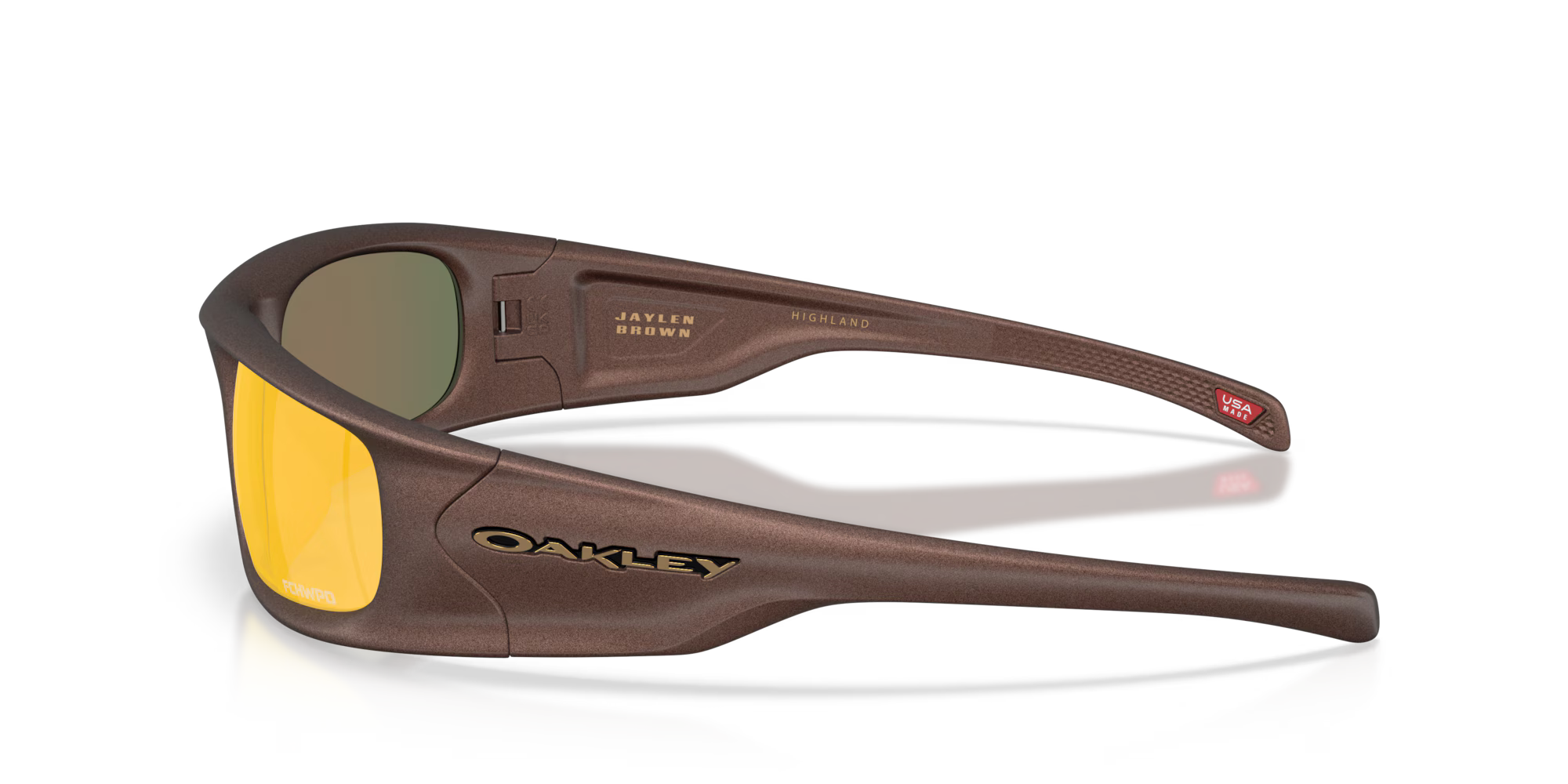 Side view of Machina Highland Jaylen Brown Signature Series eyewear featuring brown frames, yellow-tinted lenses, and “JAYLEN BROWN” plus “HIGHLAND” in gold inside the arm—a creative design from Machina Wearable Technology.