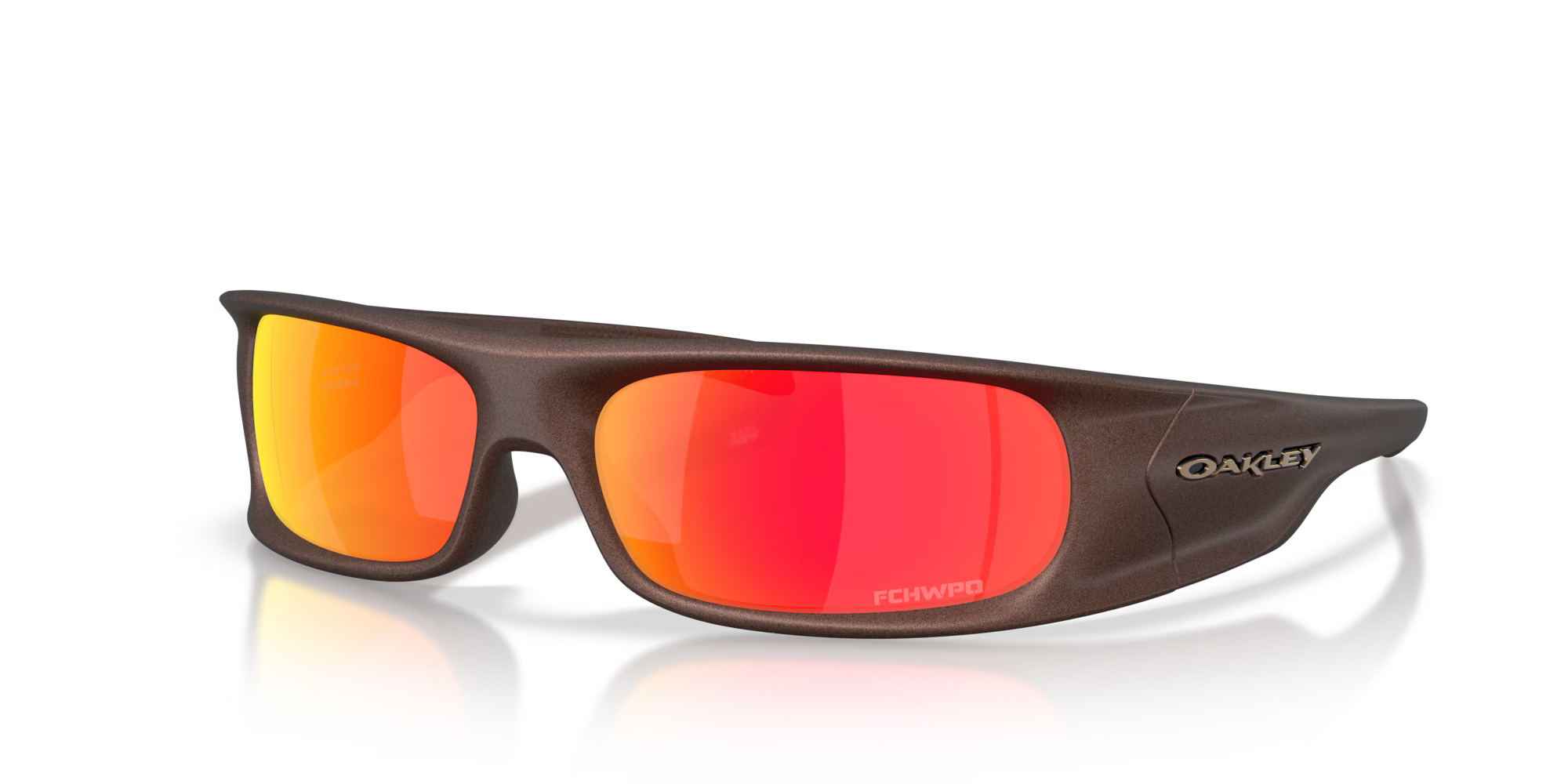 The Machina Highland Jaylen Brown Signature Series eyewear features a matte brown frame and bold red-orange mirrored lenses, shown on a white background with a subtle reflection—ideal for fans of creative frames.