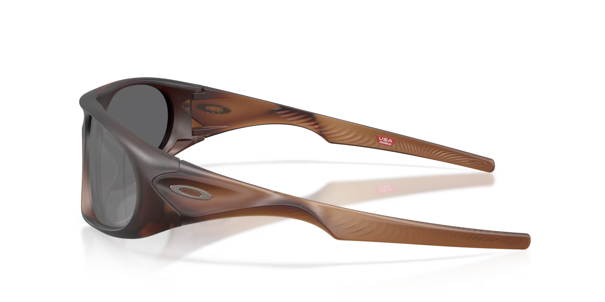 The Neoforma Matte Rootbeer sunglasses by Machina - Wearable Technology are shown side-on. They feature brown, semi-transparent high-wrap curves, dark lenses, and a marbled frame with a small Machina logo on the temple against a white background.