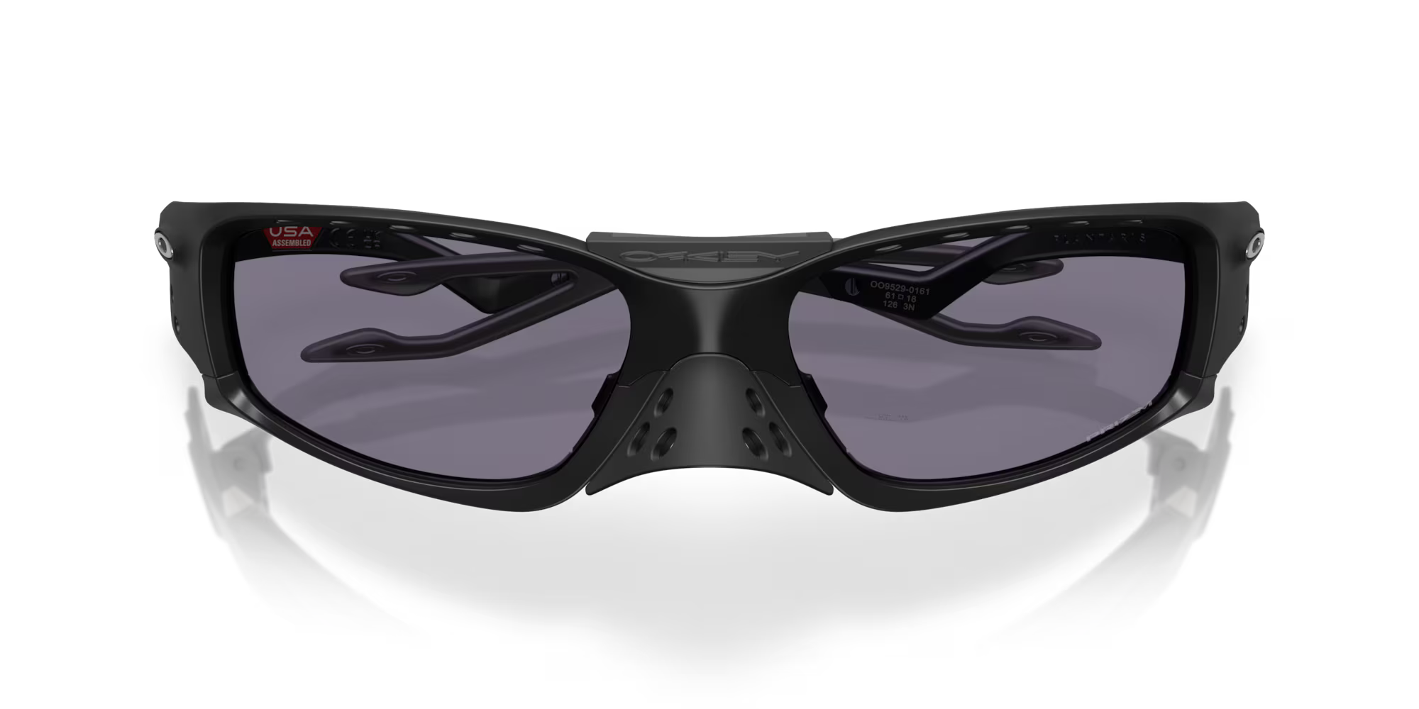 Front view of Machina - Wearable Technology Plantaris SQ Matte Black sports sunglasses with dark tinted lenses, vented nose bridge, and angular square frame, displayed on a white background.