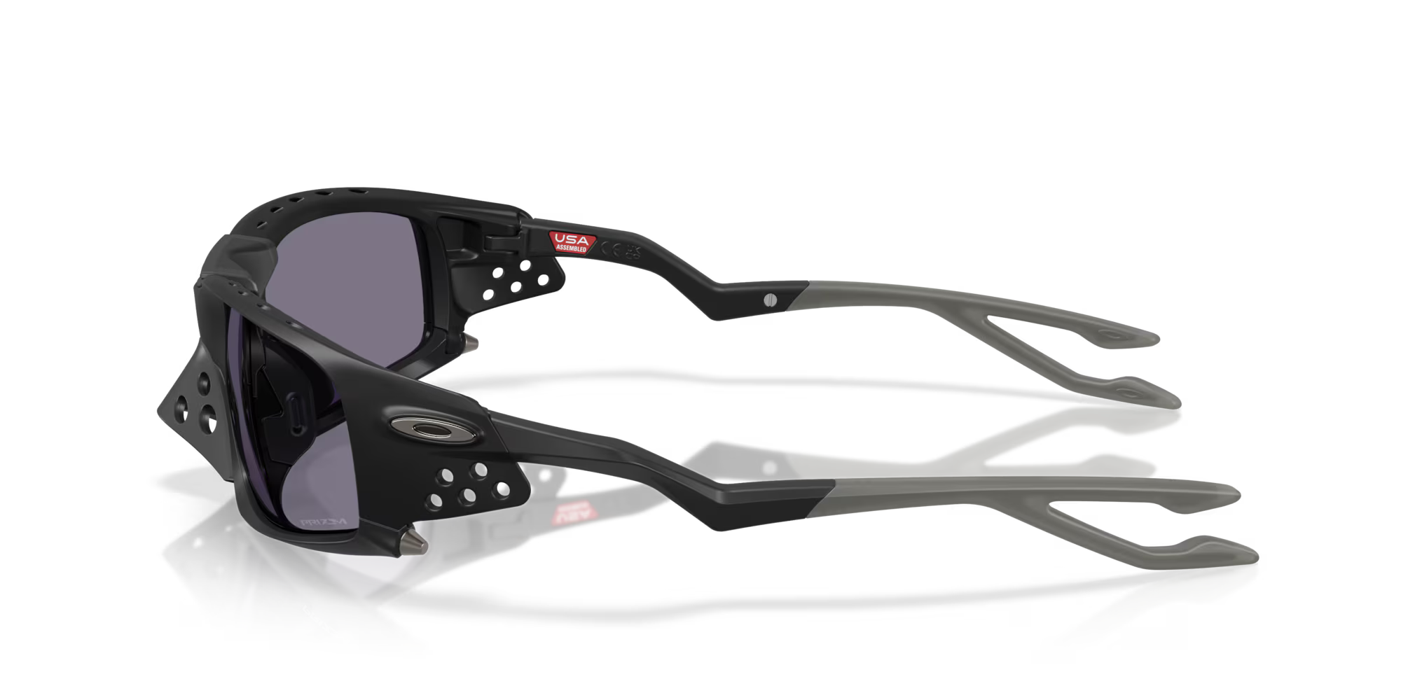 Matte black Plantaris SQ sports sunglasses by Machina - Wearable Technology, featuring angular frames with vent holes, gray-tinted square lenses, unique stems, and a USA sticker on top.
