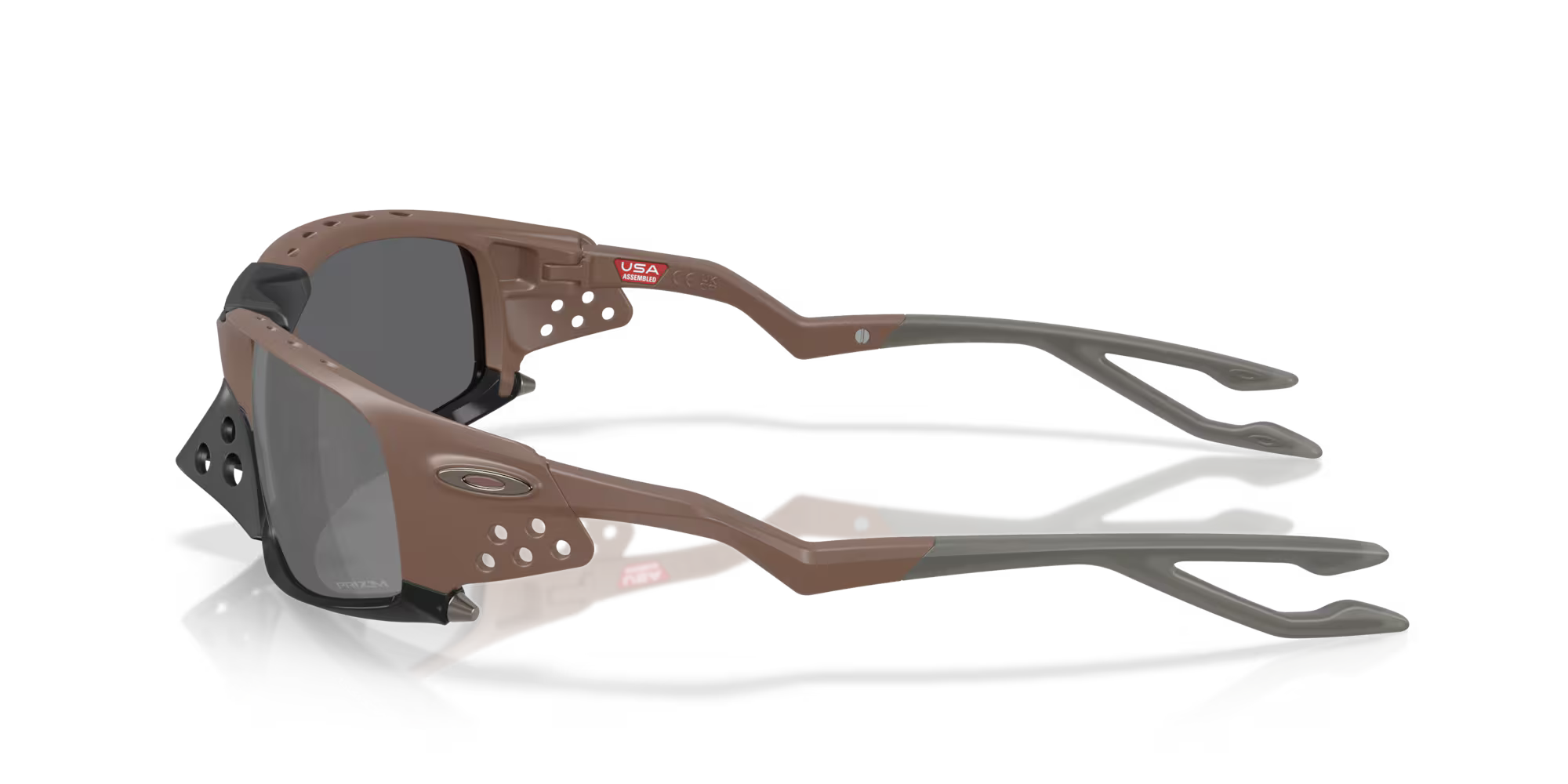 Plantaris SQ Matte Mahogany by Machina - Wearable Technology: brown and gray sports sunglasses with square lenses, black Unobtainium side shields, US flag sticker on the frame, and wraparound temple arms, shown on a white reflective surface.