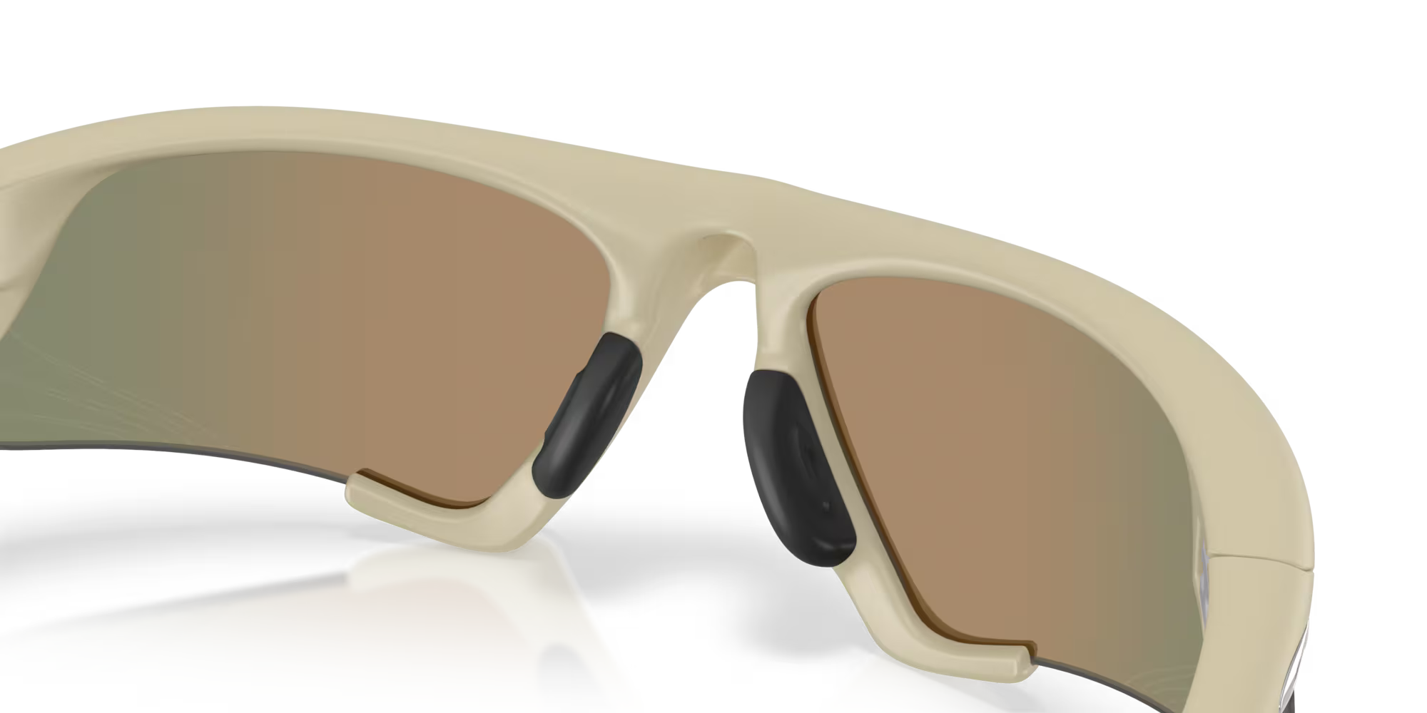 Close-up of the Suture Jacket® Matte Sand Frame by Machina – Wearable Technology, beige sport eyewear with brown-tinted lenses and black nose pads, shown from the inside on a white background.