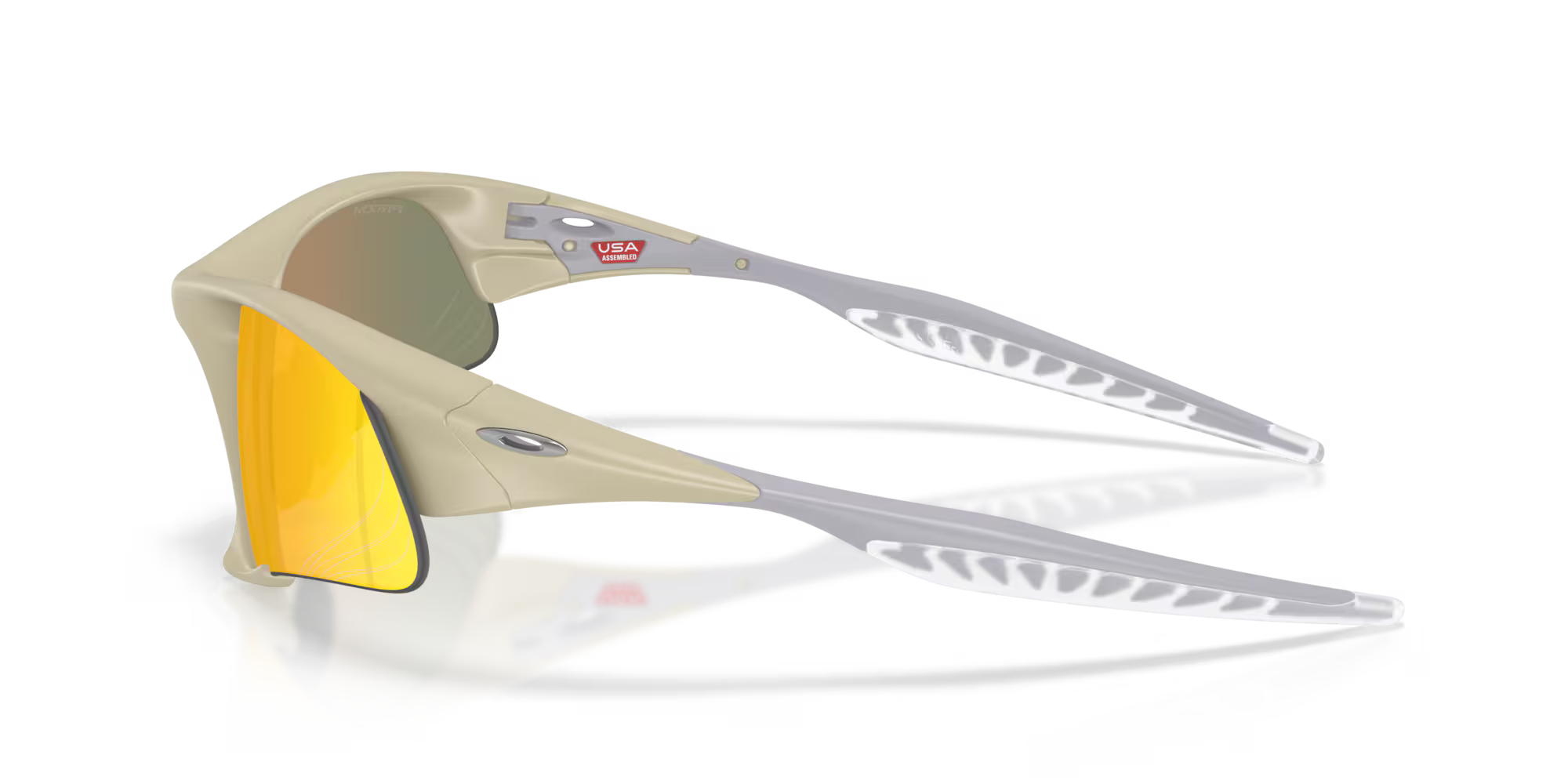 The Suture Jacket® Matte Sand Frame sunglasses by Machina – Wearable Technology feature beige high-wrap frames, mirrored yellow-orange lenses, and ventilated white ear stems with a small USA flag sticker accent at the hinge.