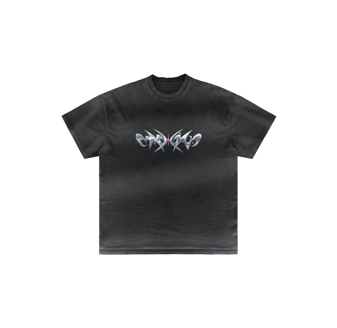 The Nagamani by Machina - Wearable Technology is a black luxury cotton t-shirt with short sleeves, showcasing a silver metallic abstract graphic across the chest, presented on a plain white background.