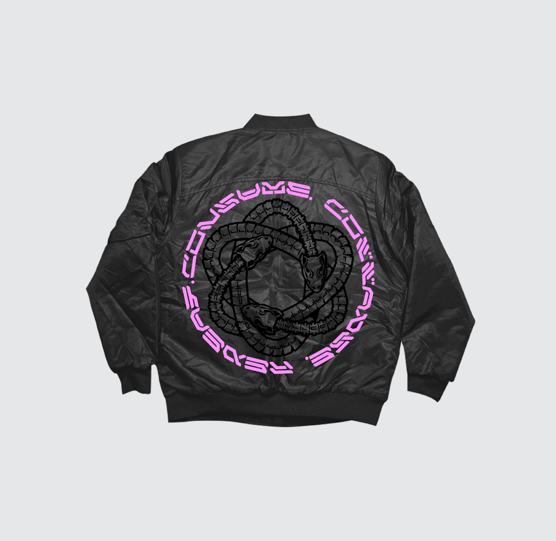 The Consume Collapse Repeat Bomber Jacket by Machina - Wearable Technology is a black bomber with interlocked snake graphics and pink "CONSUME REBELS" text on a light gray back, inspired by streetwear Mexico.