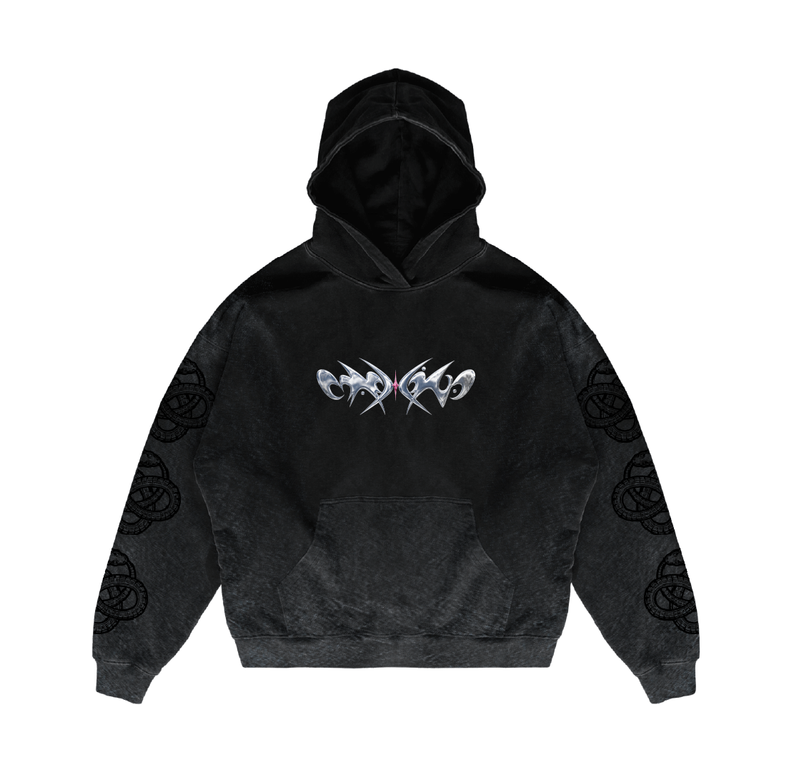 The Comfort is the parasite of growth Hoodie by Machina - Wearable Technology features heavyweight black Mexican cotton, a shiny metallic abstract chest design, intricate sleeve patterns, a relaxed oversized fit, and a front pocket.