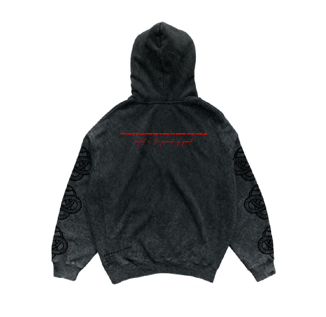 The Comfort is the parasite of growth Hoodie by Machina - Wearable Technology is a washed black, heavyweight Mexican cotton hoodie with a hood, red and white text on the upper back, circular black sleeve graphics, and a distressed finish.