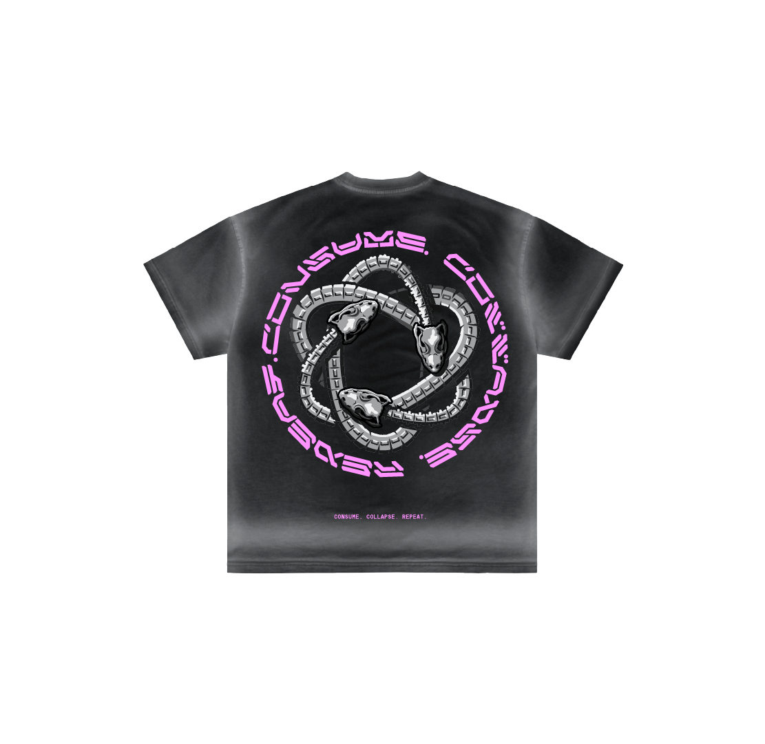 The Machina - Wearable Technology "Consume Collapse Repeat" t-shirt is a hand-dyed black luxury cotton tee with three skulls linked by silver chains in a triangle and bold pink "CONSUME COLLAPSE REPEAT" text. Made in Mexico.