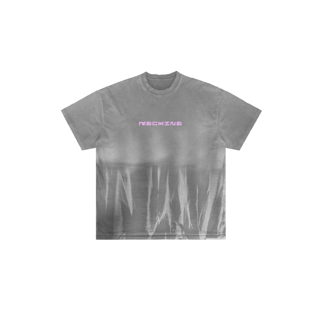 The El Ocho by Machina - Wearable Technology is a gray tee made from hand-dyed luxury cotton, with a lavender MACHINE logo centered on the chest and a washed, streaked finish at the bottom.