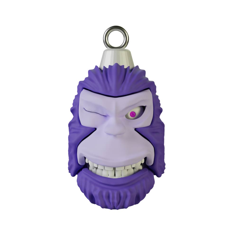 The "Pie Grande Christmas Sphere Kit" by Machina - Wearable Technology is a whimsical gorilla-shaped keychain, with a playful expression featuring a wink and a cheeky grin. It includes designer art and a convenient loop on top for easy attachment.