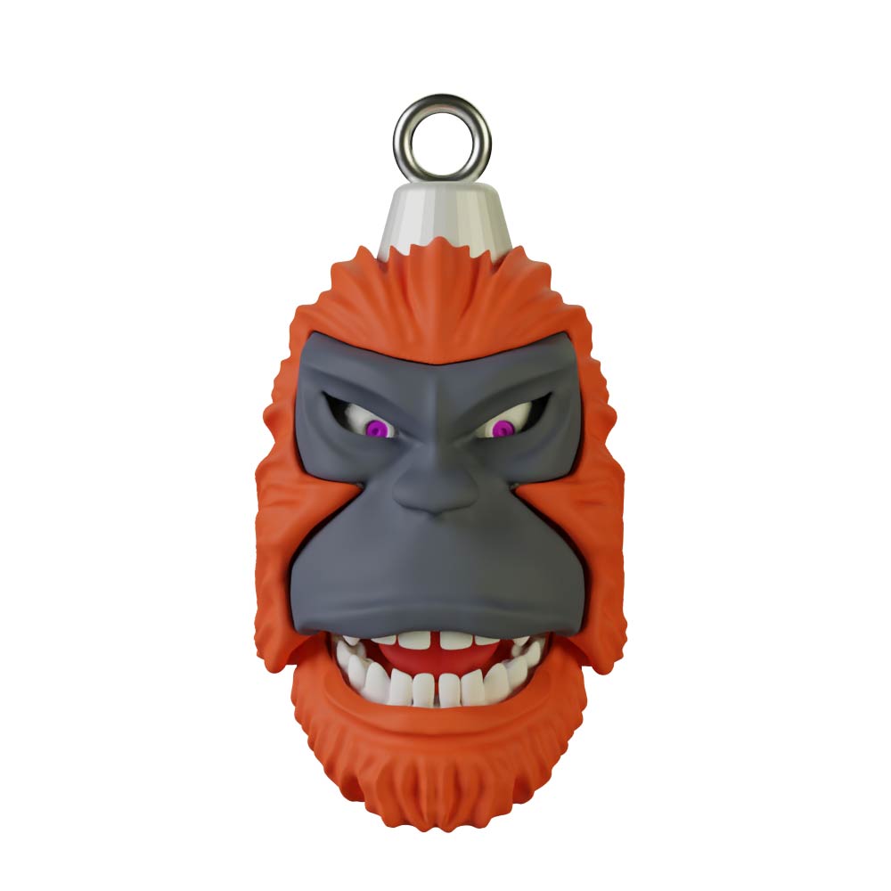 This artfully designed keychain from the Pie Grande Christmas Sphere Kit by Machina - Wearable Technology showcases a stylized, smiling gorilla face featuring vibrant orange fur, dark gray skin, and striking purple eyes. It includes a silver loop at the top for easy attachment to keys or bags.