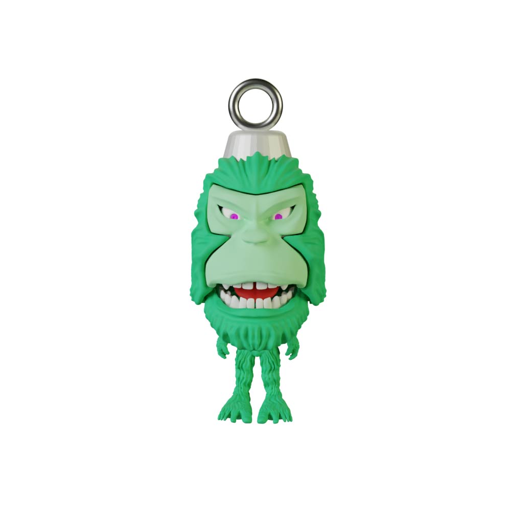 The Pie Grande Christmas Sphere Kit by Machina - Wearable Technology is a charming ornament that embodies the spirit of urban folklore with its green cartoon monster design. It showcases a smiling face, vibrant purple eyes, and a metal loop for easy hanging. With furry arms and legs, it playfully nods to designer art through its delightfully whimsical appearance.