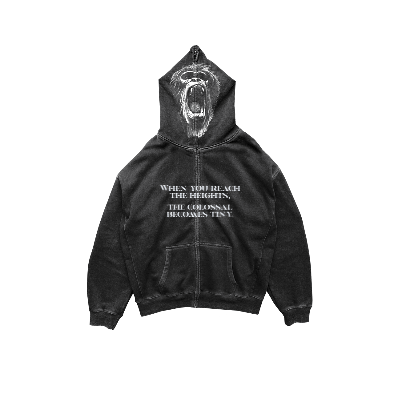 The "El Vigilante" hoodie by Machina - Wearable Technology features a roaring gorilla face on the hood. Made from French terry cotton, it offers both comfort and style. The front displays the phrase "WHEN YOU REACH THE HEIGHTS, THE COLOSSAL BECOMES TINY." This black hoodie is designed with a zipper and front pockets against a white background.