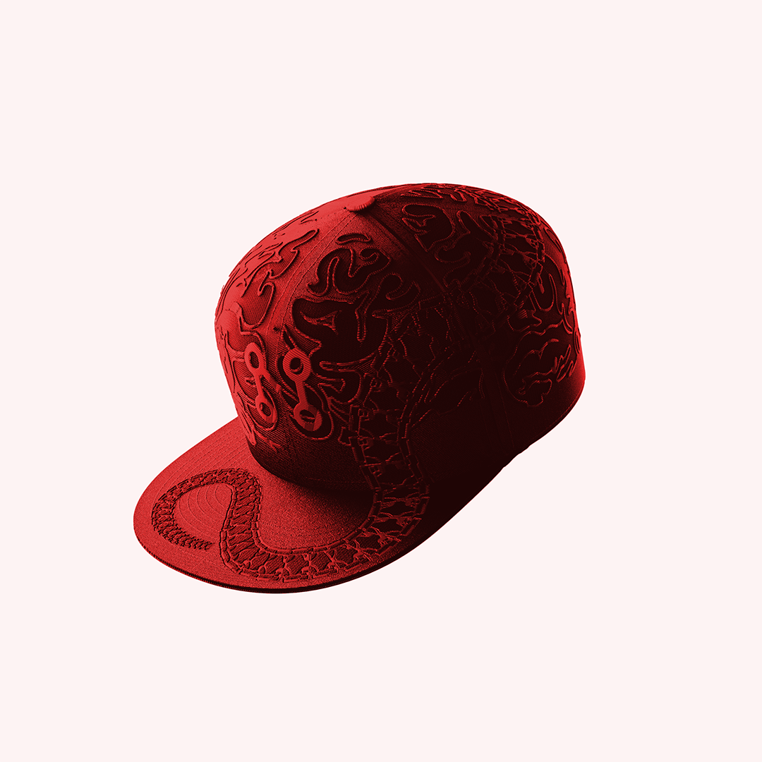 The Inferno Neuro Loop Cap by Machina - Wearable Technology, a red embroidered cap with embossed abstract patterns ideal for streetwear, is showcased on a light pink background.