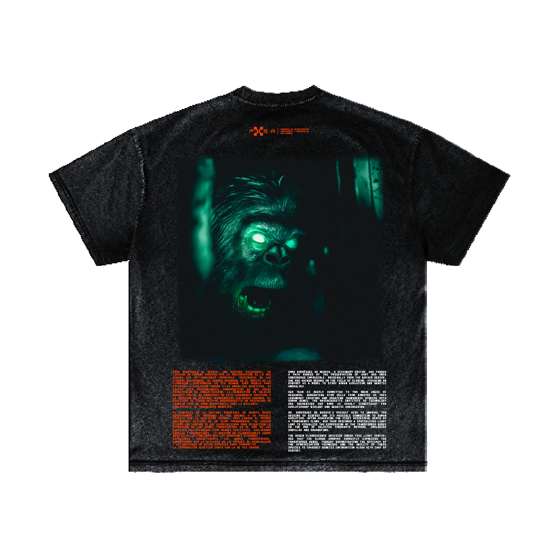 The "Pioneers in Genetic Research" T-shirt from Machina - Wearable Technology showcases a glowing green gorilla face at its center, capturing the enigma of Bigfoot cloning. Below the image, vivid orange and white text contrasts with the subtly distressed fabric.