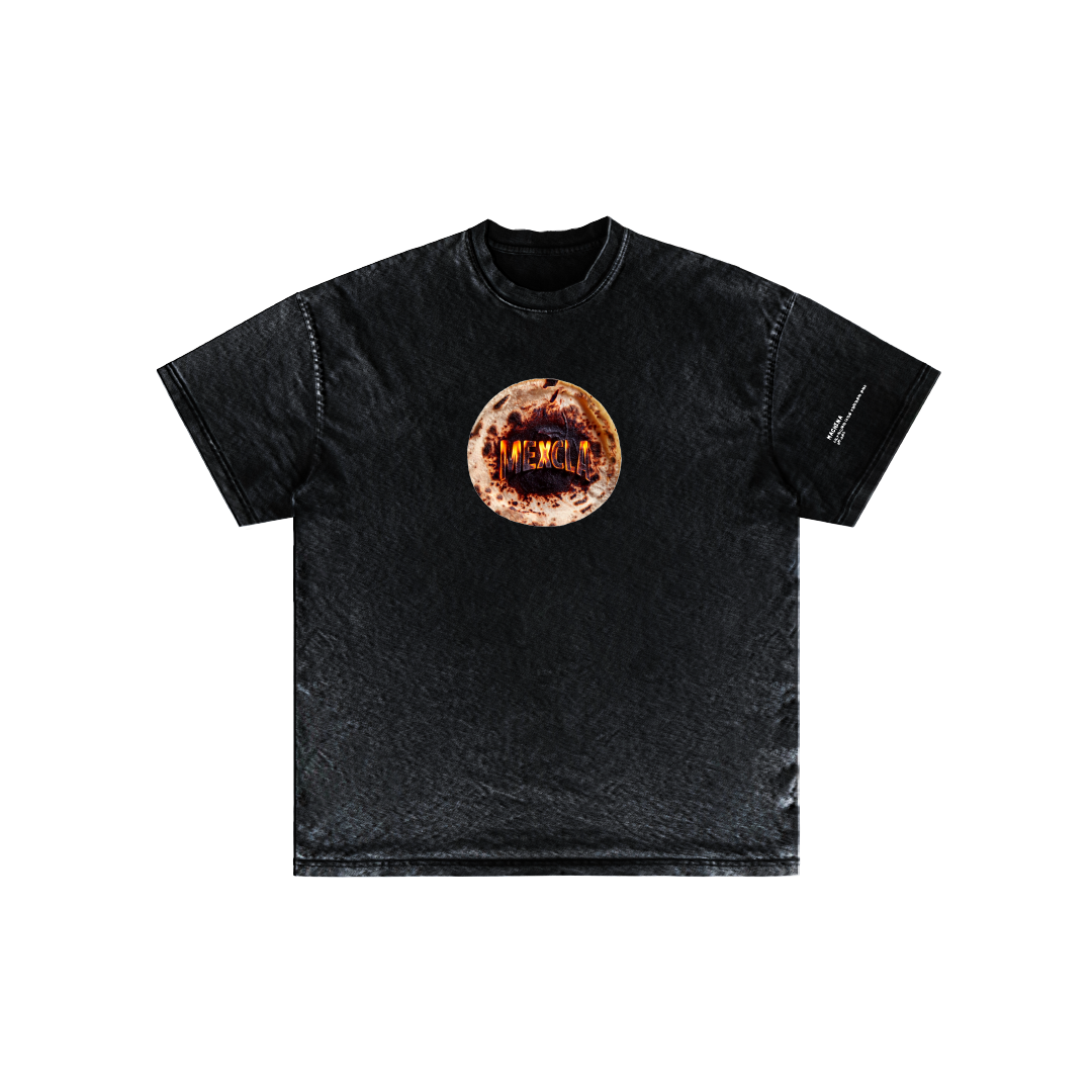 Here's a revised version of the sentence using the given product data:

The Tortilla Milagro T-shirt from Machina - Wearable Technology showcases a central circular graphic with abstract elements in shades of orange and white that evoke fiery imagery. Crafted from soft Mexican cotton, this black short-sleeve shirt delivers a simple, classic style ideal for capturing the essence of Mexcla festival vibes.