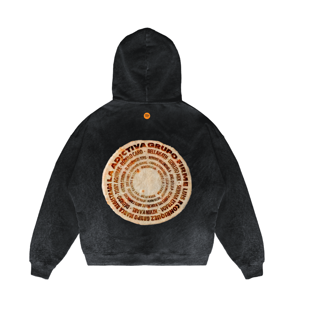 A back view of the Machina - Wearable Technology Tortilla Milagro Hoodie, made from heavyweight French terry cotton. This black hoodie features a circular design with multilingual text, resembling a record with concentric circles, prominently displayed on the upper back for an impactful visual appeal.
