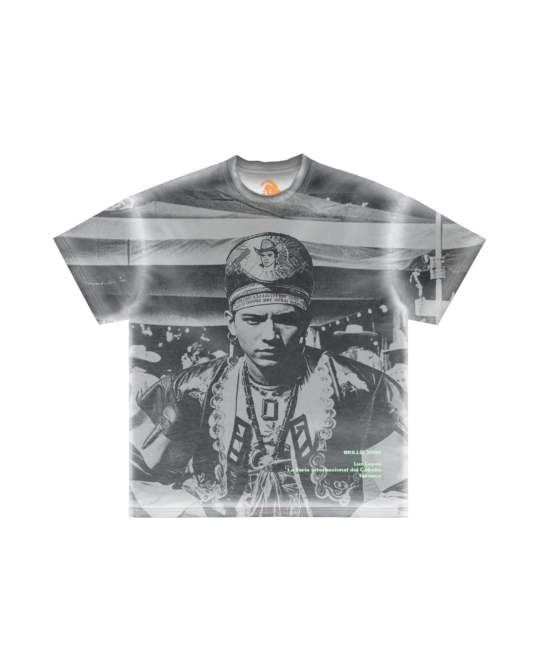 Introducing the Ángel tee by Machina - Wearable Technology: This T-shirt features a grayscale photo of a person in traditional attire amidst geometric patterns, highlighted with bright green text at the bottom right, embodying a unique regional movement vibe.