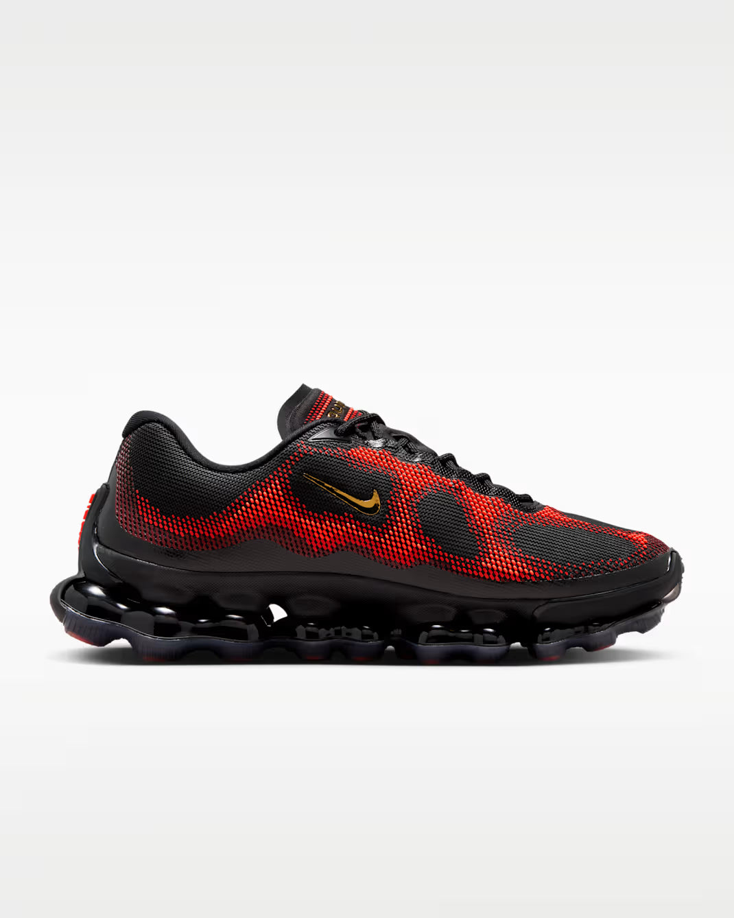 The Air Liquid Max 'Bright Crimson Fire Red' by Machina Wearable Technology features a black and fire red colorway with a gold swoosh and wavy black sole, shown on a plain light background.