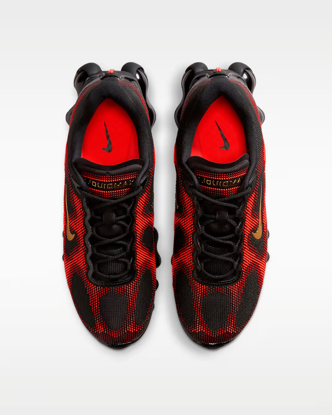 Top view of a pair of Machina Wearable Technology Air Liquid Max 'Bright Crimson Fire Red' sneakers with gold logos, red insoles featuring black branding, a textured upper, and Air Liquid Max cushioning for comfort.