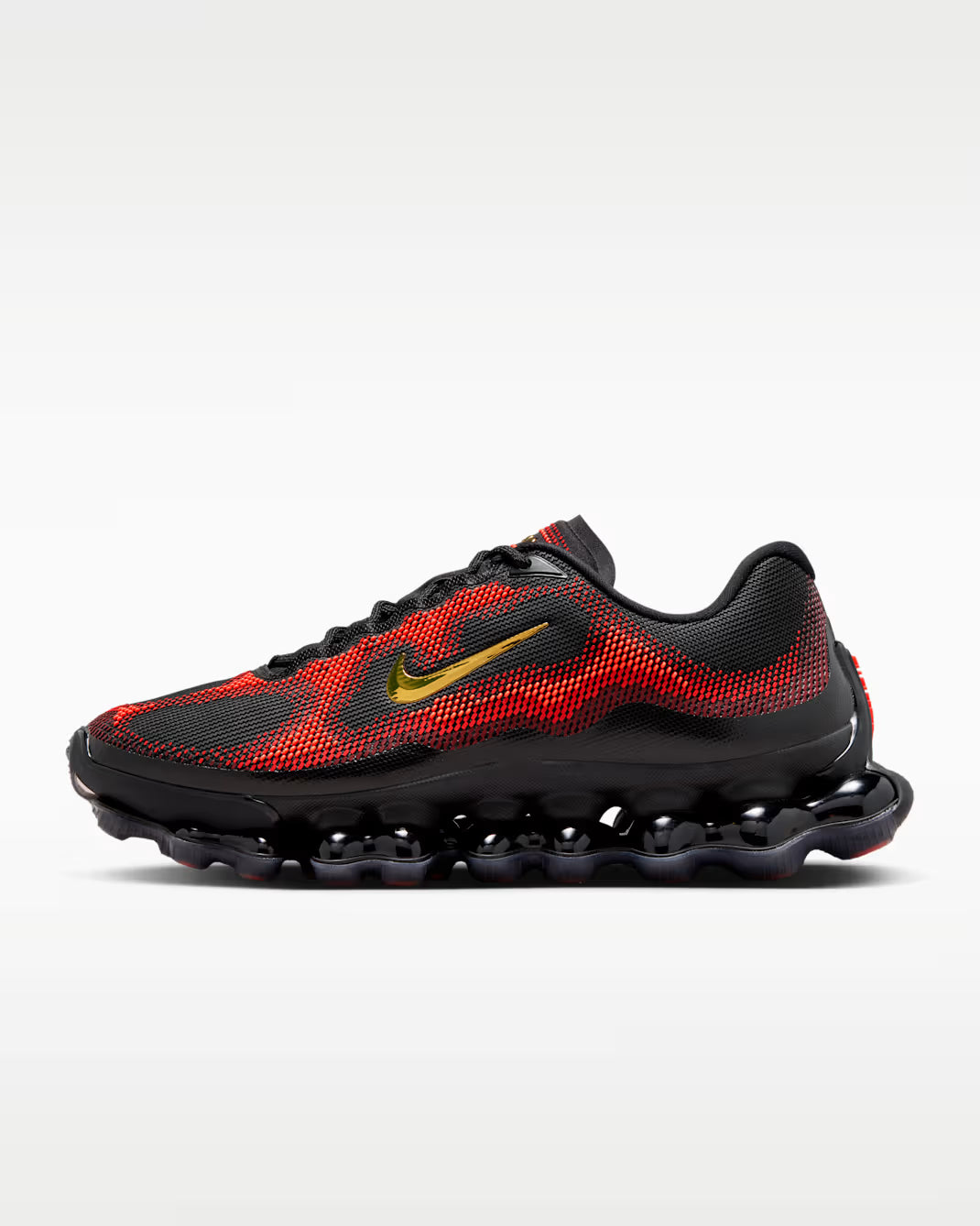 Side view of the Machina Wearable Technology Air Liquid Max 'Bright Crimson Fire Red' sneaker, featuring a black and red mesh upper, gold swoosh logo, black laces, wavy segmented black sole, all highlighted against a plain light background.