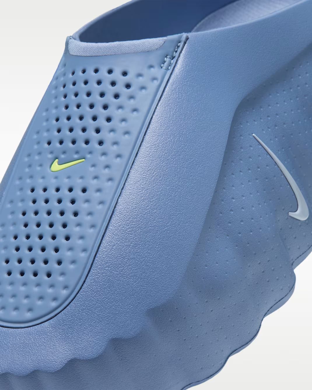 Perforated blue Machina Wearable Technology Mind 001 sensory sneakers with two small logos on the side.