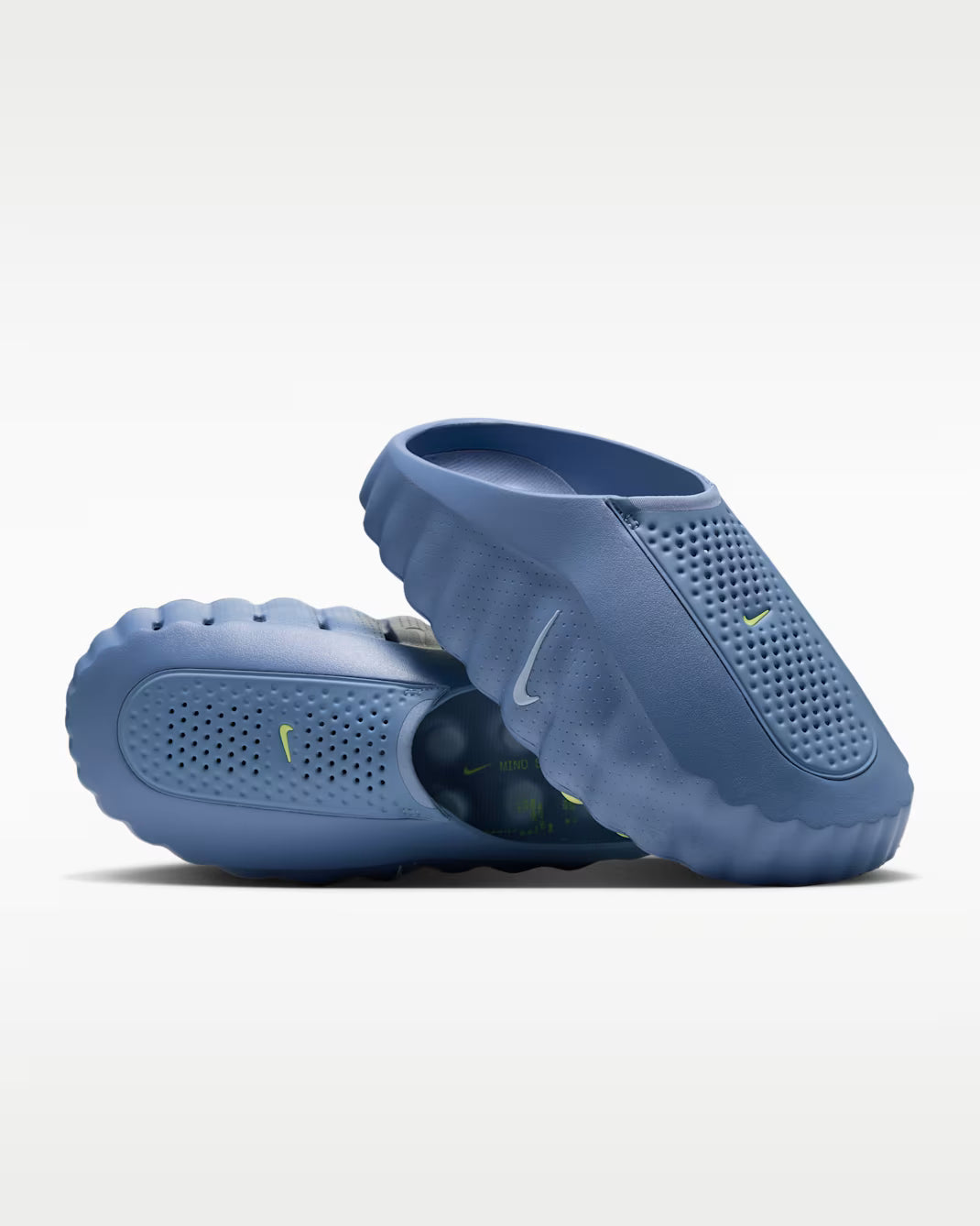 Two blue Mind 001 sensory sneakers by Machina Wearable Technology with perforated toe boxes and ridged sides.