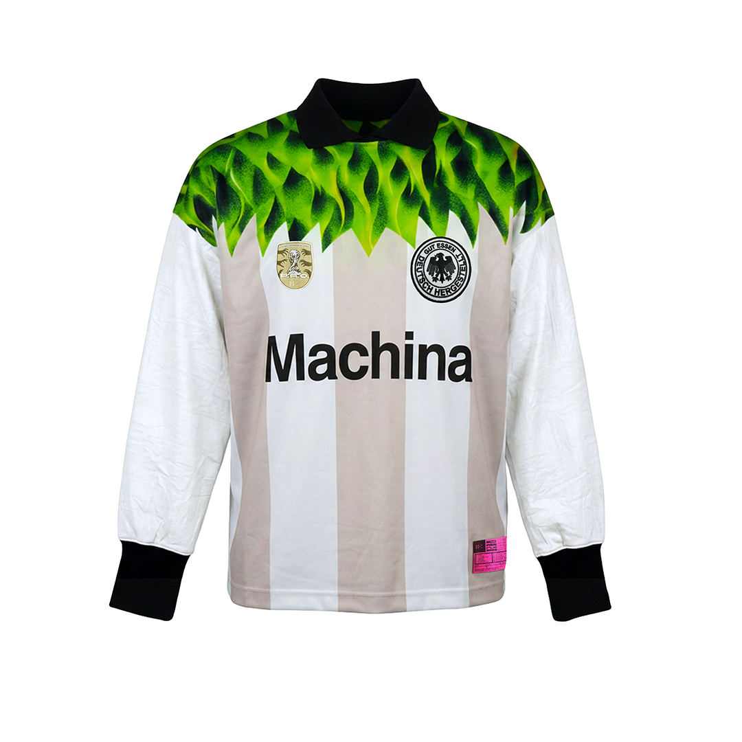 The SOPA MAGICA [Germany] jersey by Machina - Wearable Technology features beige and white vertical stripes, black collar and cuffs, green leaf shoulder pattern, two chest badges, and "Machina" across the front, inspired by the Miracle of Bern.