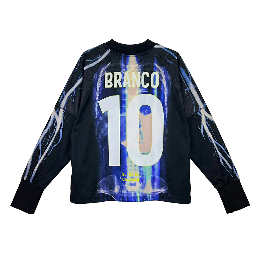 A black long-sleeve soccer jersey by Machina - Wearable Technology, AGUA MÁGICA, with blue lightning patterns, features the name BRANCO and number 10 in bold white letters on the back.