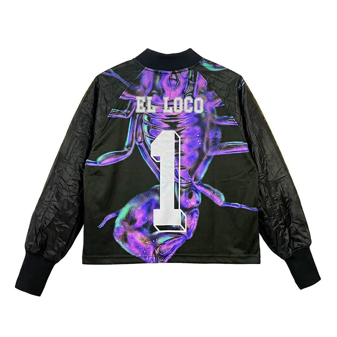 A black jacket with quilted sleeves, a bold white number 1, and EL LOCO on the back over vibrant purple and blue abstract art—a true tribute. Introducing EL ESCORPIÓN by Machina - Wearable Technology, inspired by René Higuita’s legendary style.