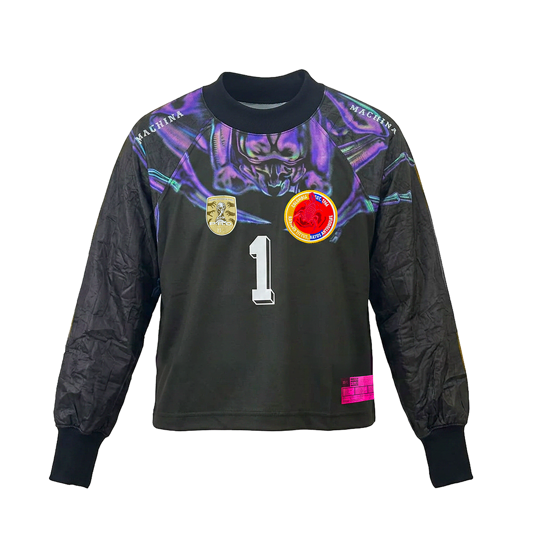 The EL ESCORPIÓN by Machina - Wearable Technology is a black long-sleeve goalkeeper jersey with padded sleeves, the number 1, colorful patches, and a purple abstract design—a tribute to René Higuita’s iconic Scorpion Kick shirt.