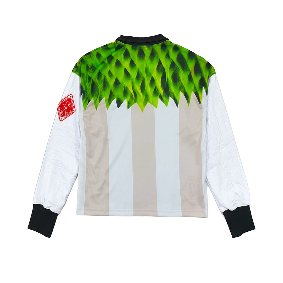 The SOPA MAGICA [Germany] by Machina - Wearable Technology features long sleeves, vertical beige and white stripes with green leafy patterns at the top, black cuffs and collar, and a red patch on the left sleeve—echoing the Hungarian Golden Team style.