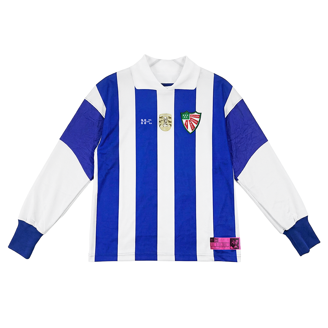 The SOU MEXICANO by Machina - Wearable Technology is a vintage soccer jersey with vertical blue and white stripes, white collar, blue cuffs, two crests, a gold chest emblem, and a pink patch near the hem—honoring World Cup history.