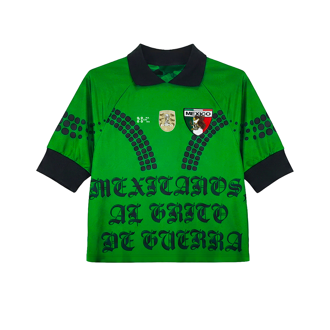The Machina - Wearable Technology "MEXICANOS AL GRITO DE GUERRA" green goalkeeper jersey features a black collar and cuffs, dual chest badges, bold anthem-inspired text, and decorative black dotted lines.