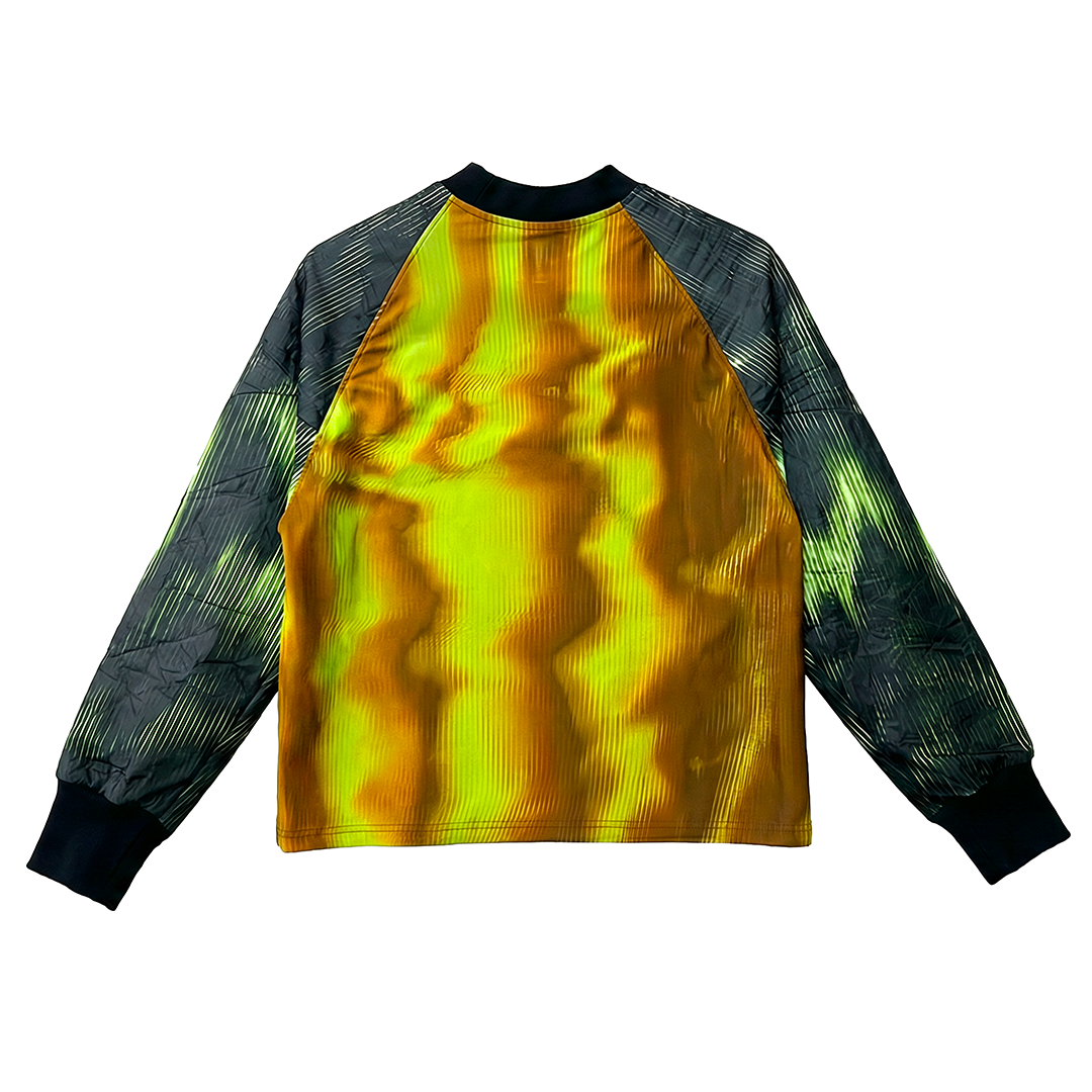 The BAFANA BAFANA jersey by Machina - Wearable Technology features black and gray patterned long sleeves, a shiny yellow-gold body, and black cuffs and collar, celebrating South Africa's football culture and the 2010 FIFA World Cup spirit.