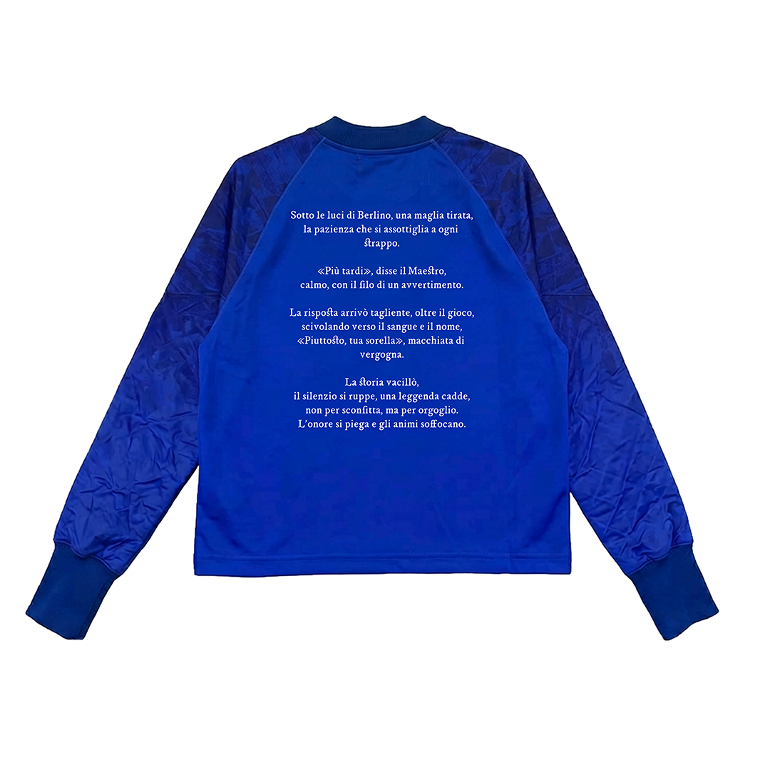 The Machina - Wearable Technology TESTATA shirt features royal blue fabric with darker blue sleeves, shown flat with the back visible. White Italian text inspired by architecture is printed centrally in varying line lengths.