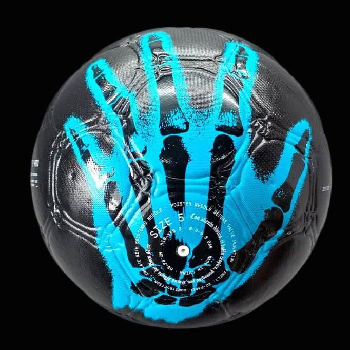 La mano de dios all black soccer ball with blue handprints.