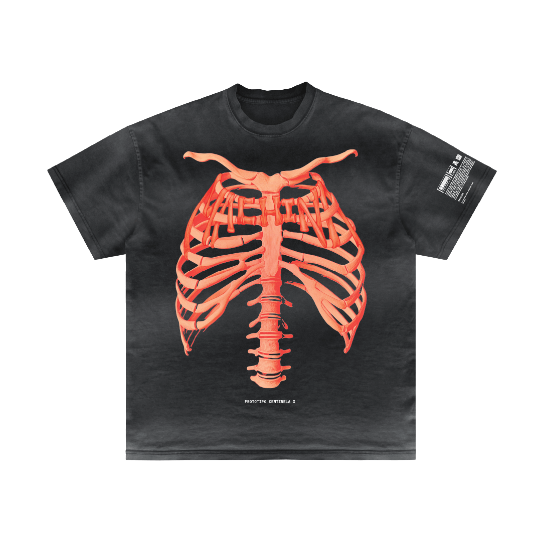 The Bigfoot Project by Machina - Wearable Technology features a black T-shirt that showcases an orange, anatomically stylized ribcage design on the front, reflecting a biomechanical hybridization theme. The intricate image stands out against the dark fabric and includes a small white text label near the bottom and an additional patch with writing on the sleeve.