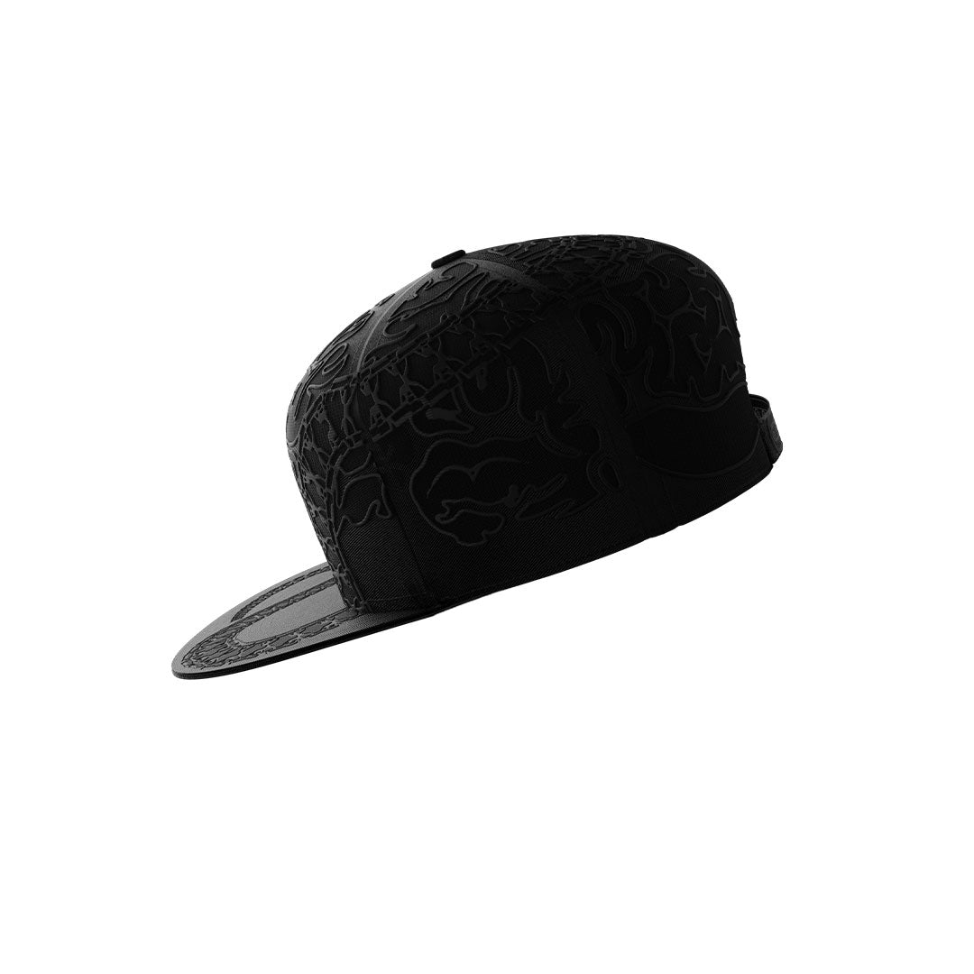 The Neuro Loop Cap by Machina - Wearable Technology is a black snapback hat with intricate dark patterns on the crown and brim, showcased on a white background—a standout streetwear accessory.