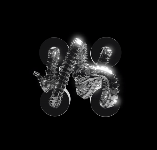 A shiny, metallic, abstract form resembling a twisted ribbon floats before four soft lights on black, evoking the Machina - Wearable Technology brand and its Ouroboros Circuit Hydra Pendant.