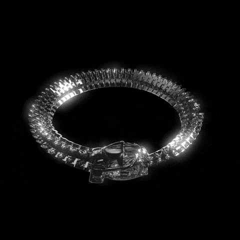 A sparkling Titans Massive Chain by Machina - Wearable Technology rotates slowly on a black background, reflecting light and showcasing its bold .925 silver design—an impressive statement alone or paired with other Machina pieces.