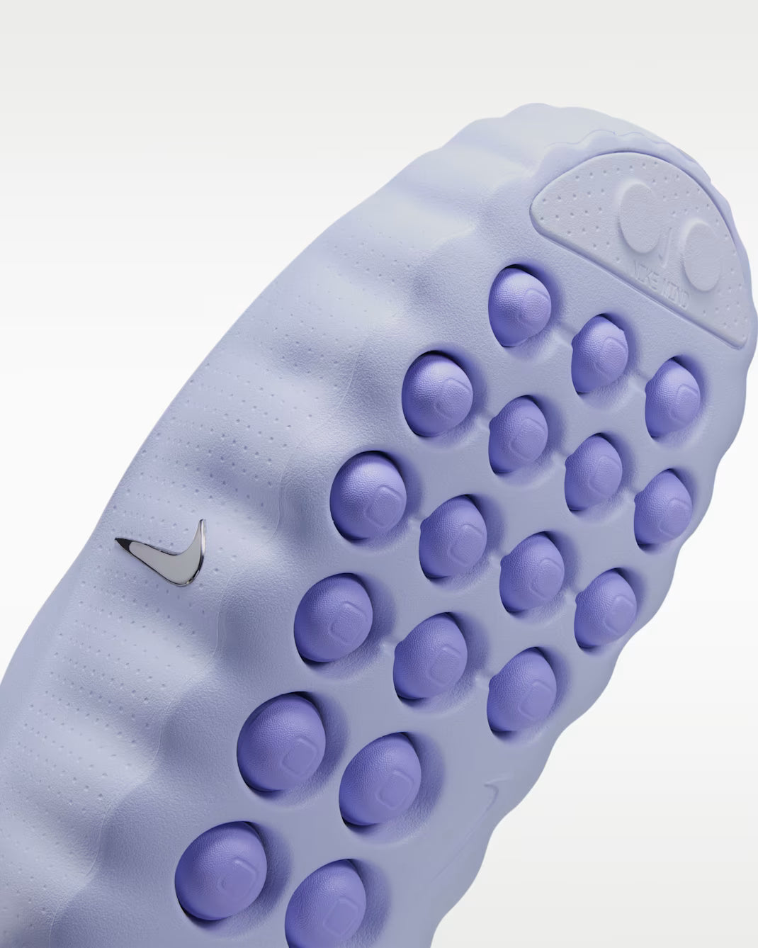 Light purple Mind 001 comfort footwear featuring a textured, lugged rubber sole and a small metallic logo on the side.